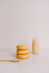 Bottle of milk and donuts, selective focus