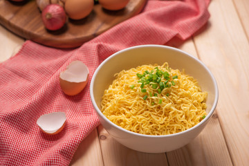 instant noodles in bowl with vegetable.