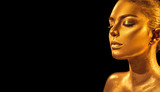 Golden skin woman face. Fashion art portrait closeup. Model girl with holiday golden glamour shiny professional makeup. Gold jewelry, accessories