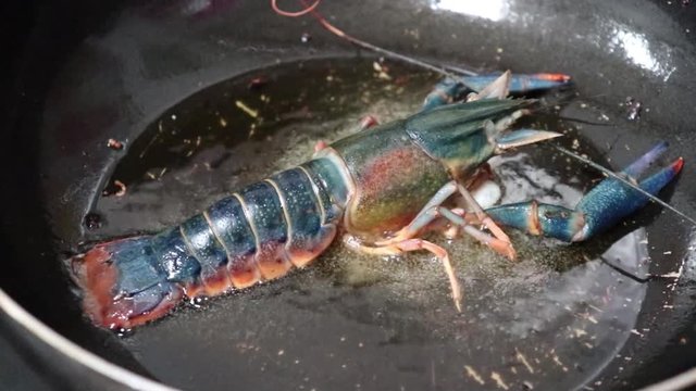 shrimp are fried in cast iron frying pans.