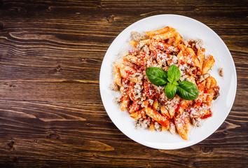 Penne with meat, tomato sauce and vegetables