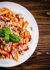 Penne with meat, tomato sauce and vegetables