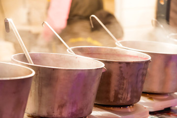 Boiling cauldrons or big pots on street food festival