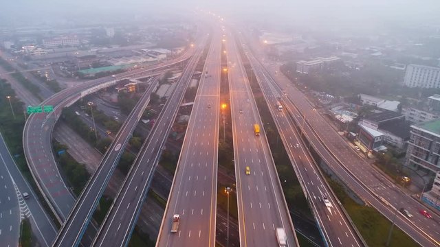 Aerial view traffic on highway with mist in morning.