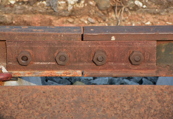 The junction of old rail, that is strong iron and big knot but these is rusty.
