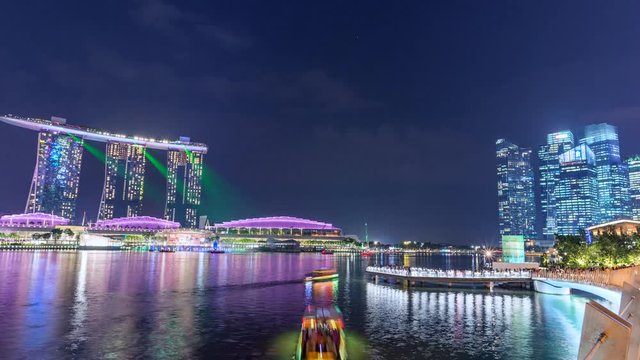 Singapore, Beautiful Time lapse of Singapore night skyline with dramatic laser and light show. 4K. Motion Timelapse Panning Right