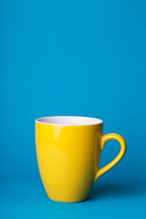 yellow cup on a blue background