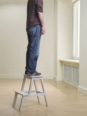 suicide illustration - man hanging himself in epmty room