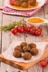Meatballs with carrot purée.