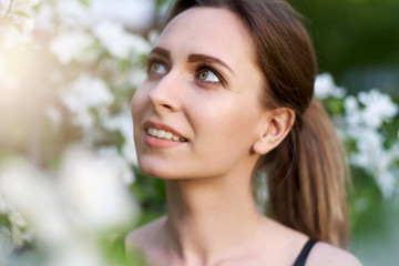 Naklejka premium large facial portrait of beautiful brunette girl with clean healthy skin