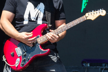 Obraz na płótnie Canvas Guitarist play electricity guitar on concert stage