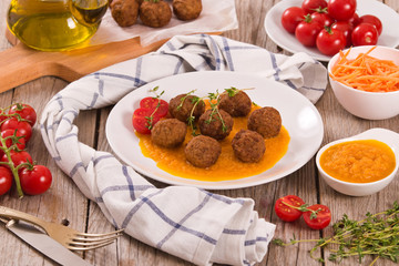Meatballs with carrot purée.