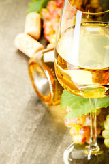 Glass of white wine on vintage wooden table. food. drink.