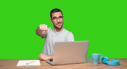 Young man sitting at his desk