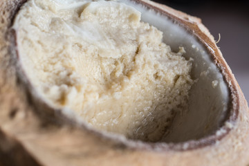 Khanom Mo Kaeng is traditional Thai custard made of Mung Beans, here served inside a young coconut