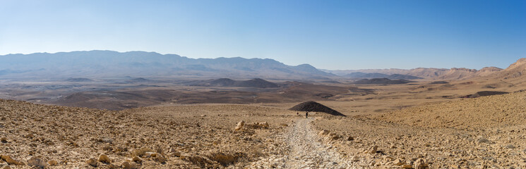 Trekking in Negev dramatic stone desert, Israel