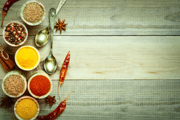 Wooden table of colorful spices.