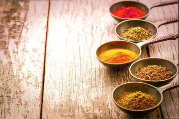 Wooden table of colorful spices.