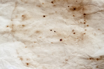 Texture of old paper with dirt stains, spots, wrinkle, grunge vintage background