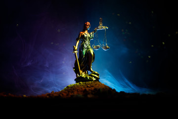 Naklejka premium The Statue of Justice - lady justice or Iustitia / Justitia the Roman goddess of Justice on a dark fire background