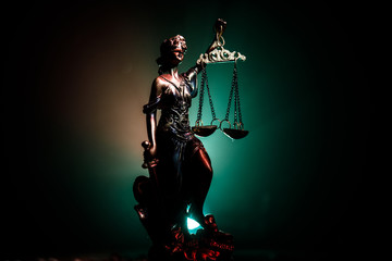 The Statue of Justice - lady justice or Iustitia / Justitia the Roman goddess of Justice on a dark fire background