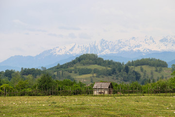 Old wooden barn in the village in Caucasus mountains
