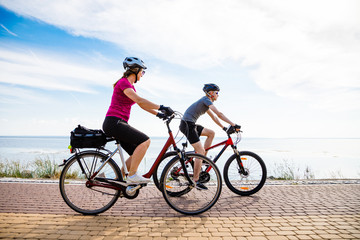 Fototapeta premium Healthy lifestyle - people riding bicycles