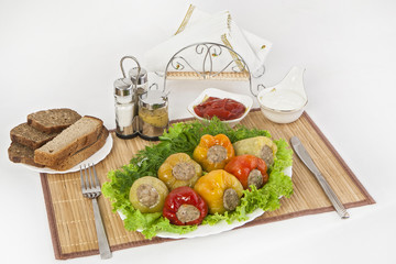 Bulgarian pepper stuffed with meat with herbs sauce and sour cream. A fine meal for lunch.