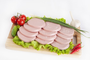 Sausage boiled with greens, tomatoes and cucumbers. Served with black or white bread. This is a good breakfast at the beginning of the day. © AKlion