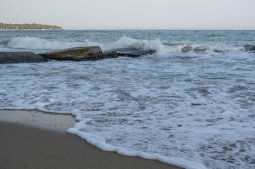 Beautiful view and waves on the beach in Varna, the sea capital of Bulgaria. What's better than sunny weather, sea and sight, waves and a nice company.