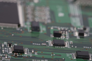 Electronic components are mounted on the device board Chips diodes capacitors chokes Close-up
