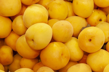 Ripe apricots fruit background in shop window