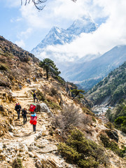 Fototapeta premium Pheriche, Nepal 04/16/2018 : Trekker with the beautiful mountains background