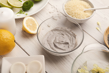 Mud mask emultion on white wooden table
