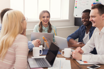 Young team discussing project in modern office