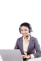 Beautiful call center operator with laptop on studio