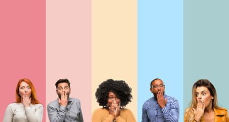 Cool group of people, woman and man covers mouth in shock, looks shy, expressing silence and mistake concepts, scared