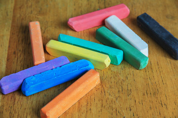 colored chalk on a wooden table