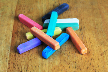 colored chalk on a wooden table
