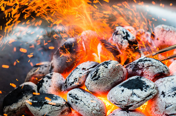 Arranged coals (selective focus) ready for barbecue