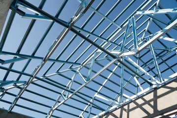 Naklejka premium Structure of steel roof frame for building construction.