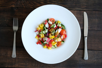 salad from vegetables on old wooden table