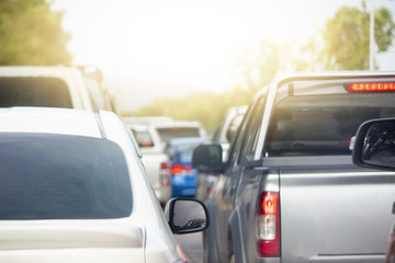 Cars on the road heading towards the goal of the trip, Stop by traffic jam in junction in Thailand.