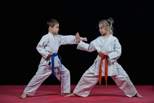 Children are training karate blows