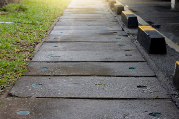 Cement drainage along the parking lot, Wet floor of rain.