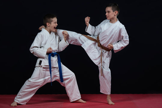 Children are training karate blows
