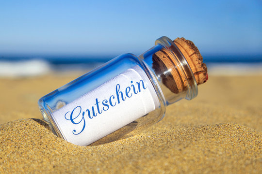 Flaschenpost am Strand: Gutschein