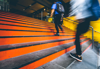 Fototapeta premium Motion blurred people going up the stairs in downtown Melbourne, Australia
