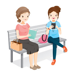 Old Woman Reading Book, Young Woman Playing Smartphones. They Sitting On Bench Together, People, Lifestyle, Generation, Age