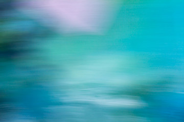 Creative abstract background resembling brush or pastel painting full of dynamics in green, blue, white, etc.